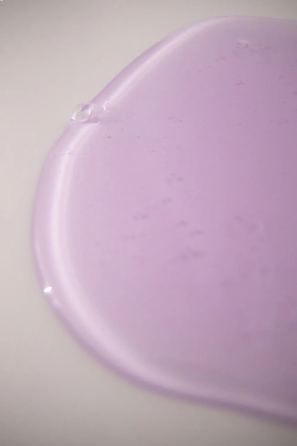 Dimensional quality of Gel Couture top coat in light lavender against a smooth surface demonstrating shine
